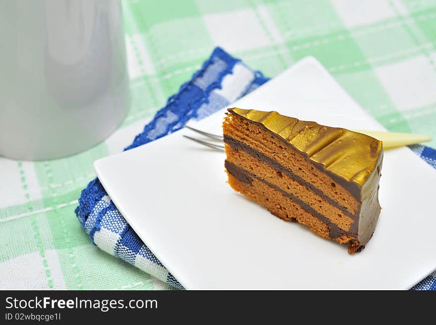 A slice of mouth watering golden chocolate cake. Suitable for celebrations, festivals, and food and beverage concepts. A slice of mouth watering golden chocolate cake. Suitable for celebrations, festivals, and food and beverage concepts.