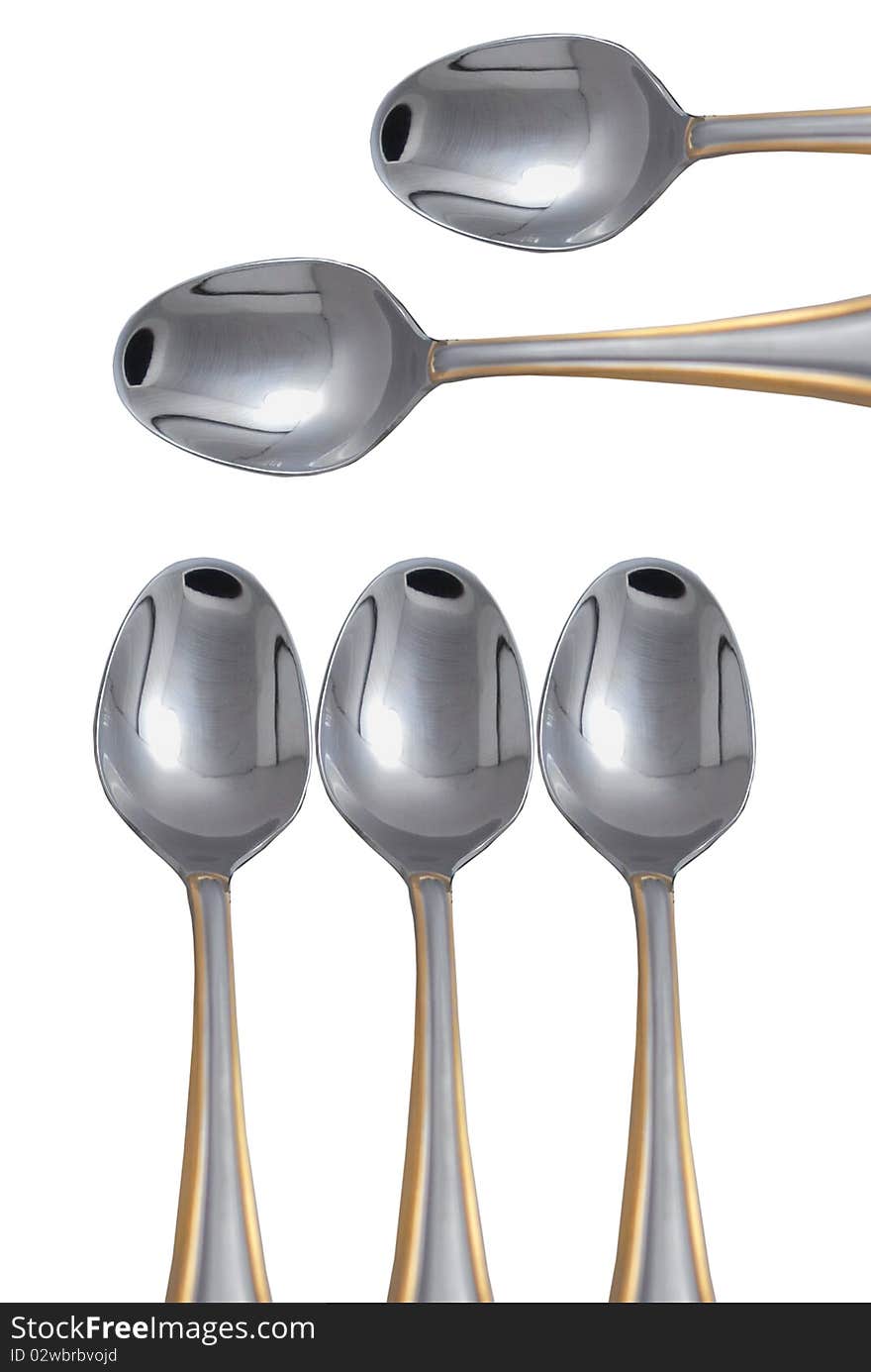 Several metal spoons  on a white background
isolated