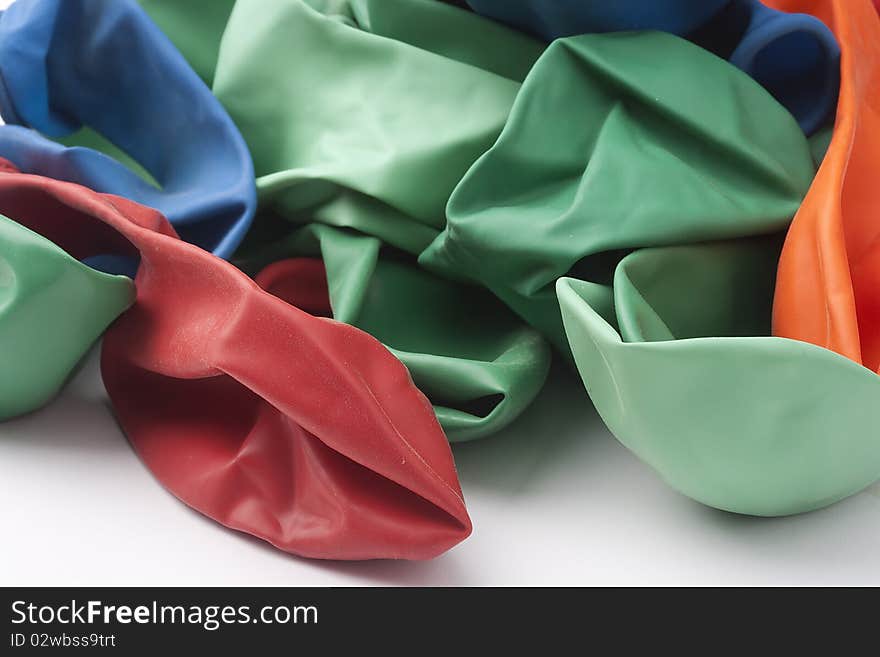 Inflatable balls of different colour from latex on a white background.