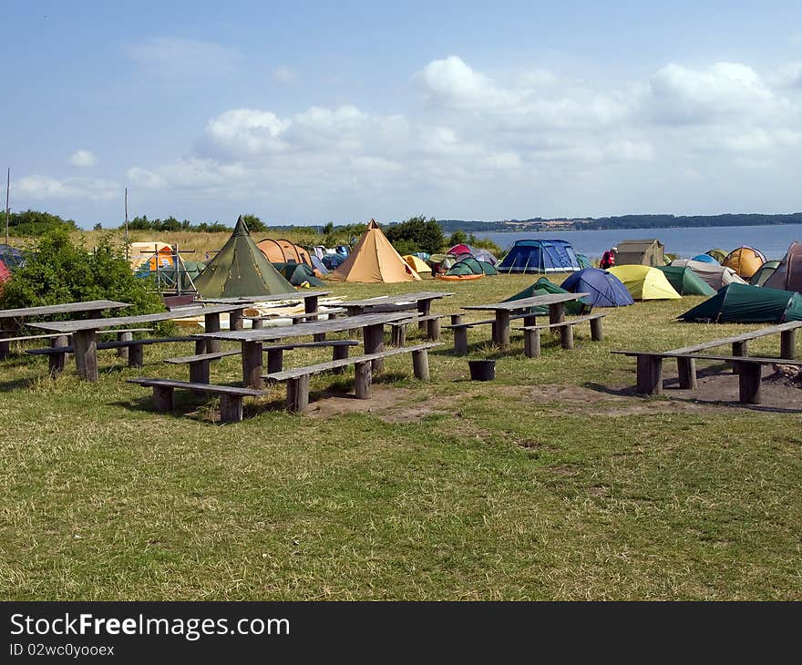 City of colorful tents in a sea beach camping site village. City of colorful tents in a sea beach camping site village