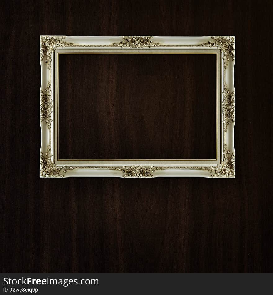 Vintage frame on dark wood background