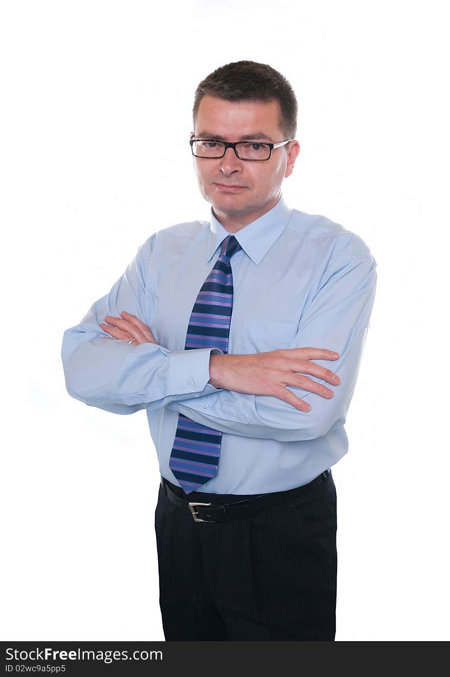 Business man isolated on white. Looks seriously at camera. Arms folded. Business man isolated on white. Looks seriously at camera. Arms folded.