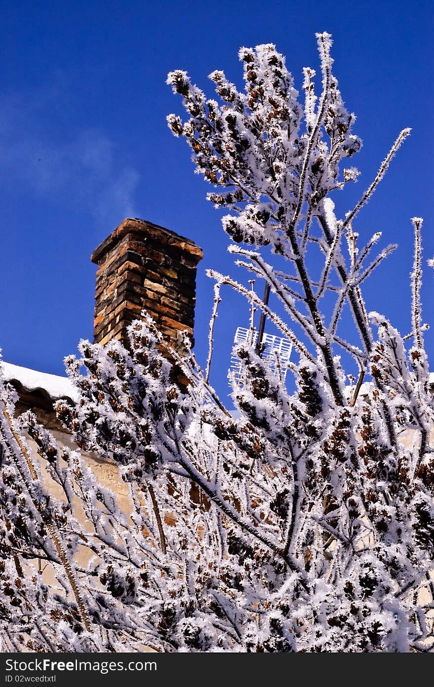 Chimney snow roof winter house trees building sky christmas. Chimney snow roof winter house trees building sky christmas