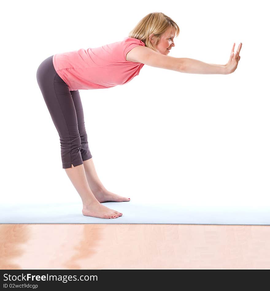 Young smiling woman making fitness indoor. Young smiling woman making fitness indoor