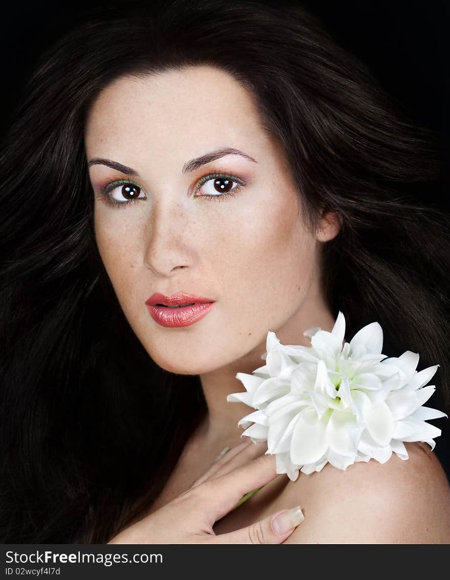 Woman with frackles holding flower