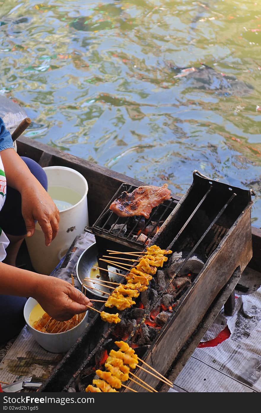 Cooking on floating market