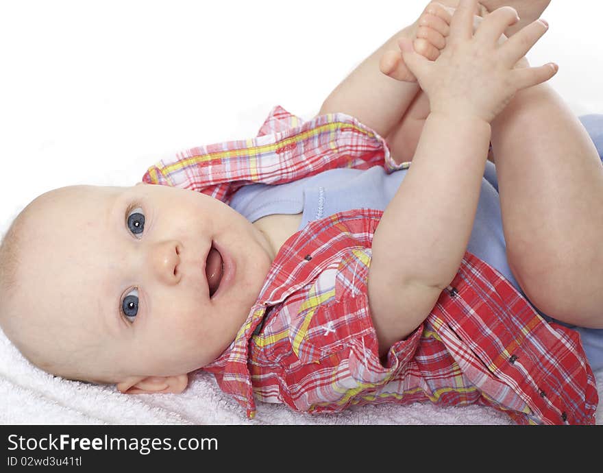 Cute baby boy smiling at camera