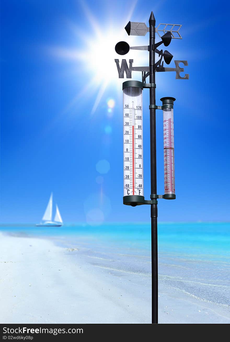 Sandy beach at sumer sunny day and thermometer