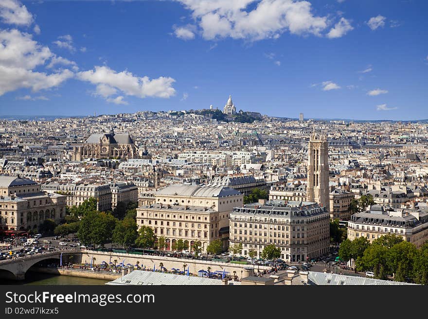 From Notre Dame at a summer day. Can see l'hotel de Ville, St. Jacques tower, St Eustache and Montmartre with the Sacre Coeur on top. From Notre Dame at a summer day. Can see l'hotel de Ville, St. Jacques tower, St Eustache and Montmartre with the Sacre Coeur on top