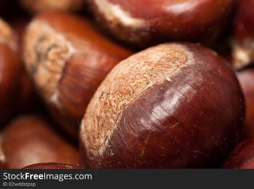 Raw chestnuts in a bowl.