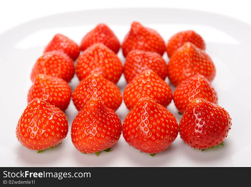 Strawberries lying on white plate. Strawberries lying on white plate