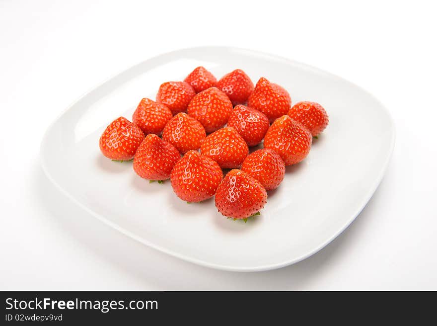 Strawberries lying on white plate. Strawberries lying on white plate