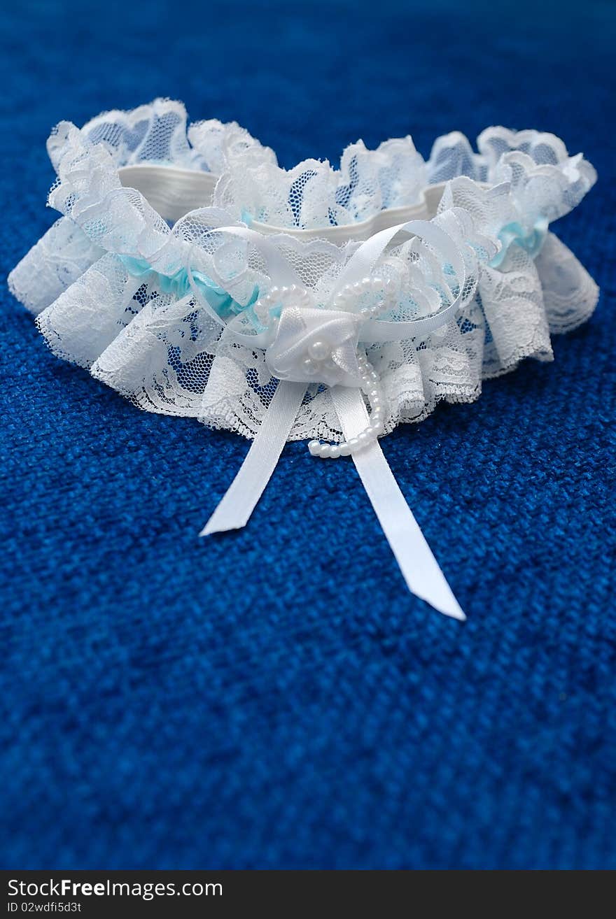 Wedding garter with a blue background