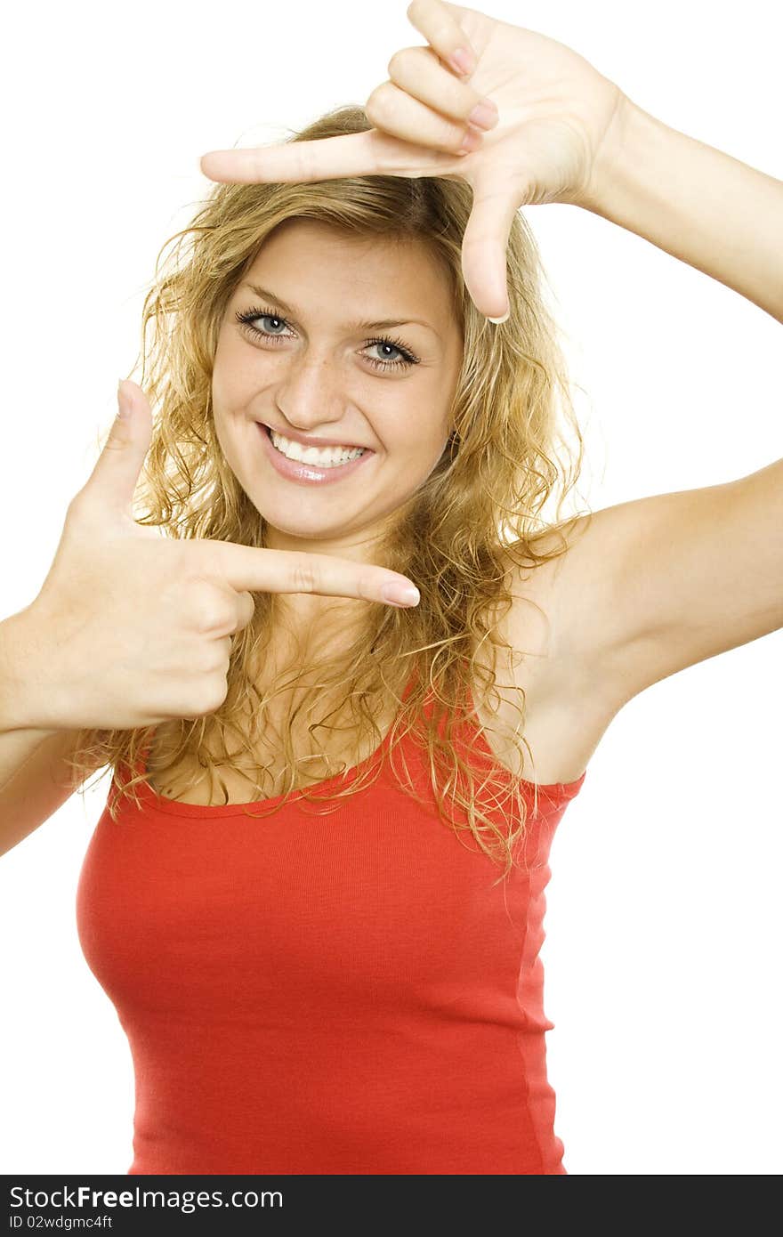 Young attractive woman looking through a frame made by hand. Isolated on a white background. Young attractive woman looking through a frame made by hand. Isolated on a white background