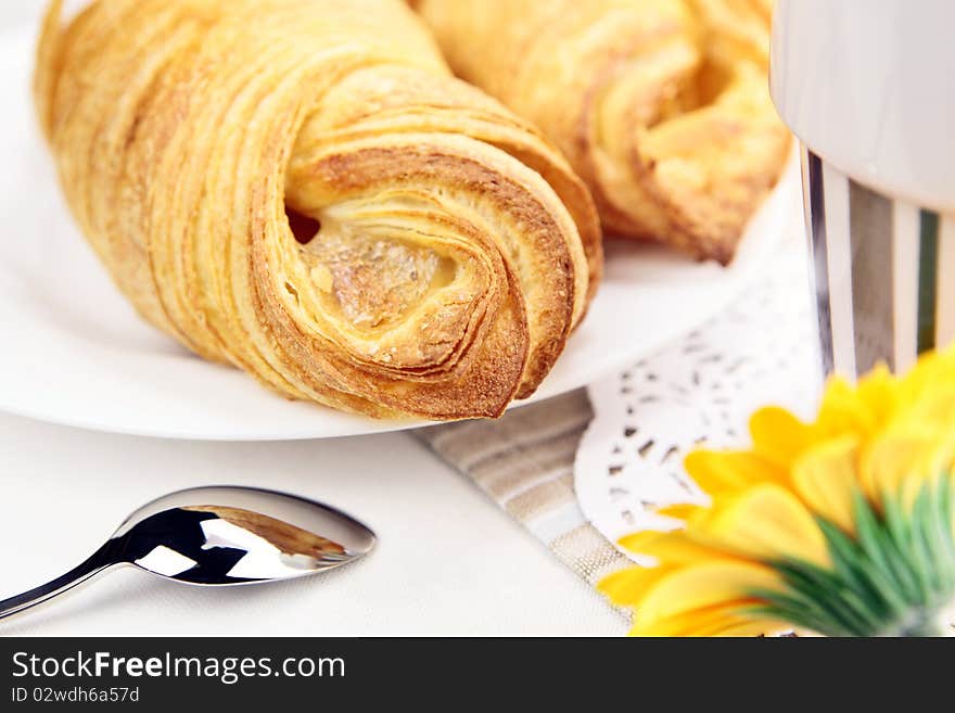 Fresh croissant closeup on breakfast table