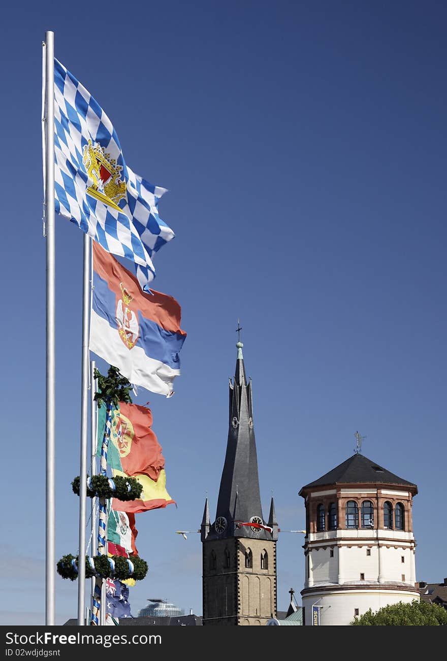 Flags and the Church of St. Lambertus in Düsseldorf, Germany