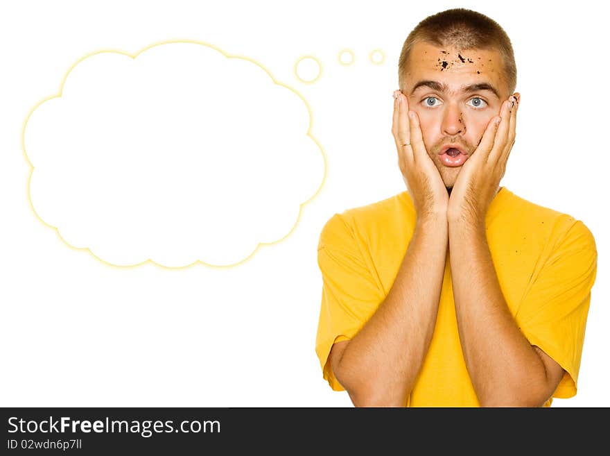 Handsome young man, his face and hands stained the ground. Face guy expresses shock, his hands are on her cheeks. Isolated on a white background