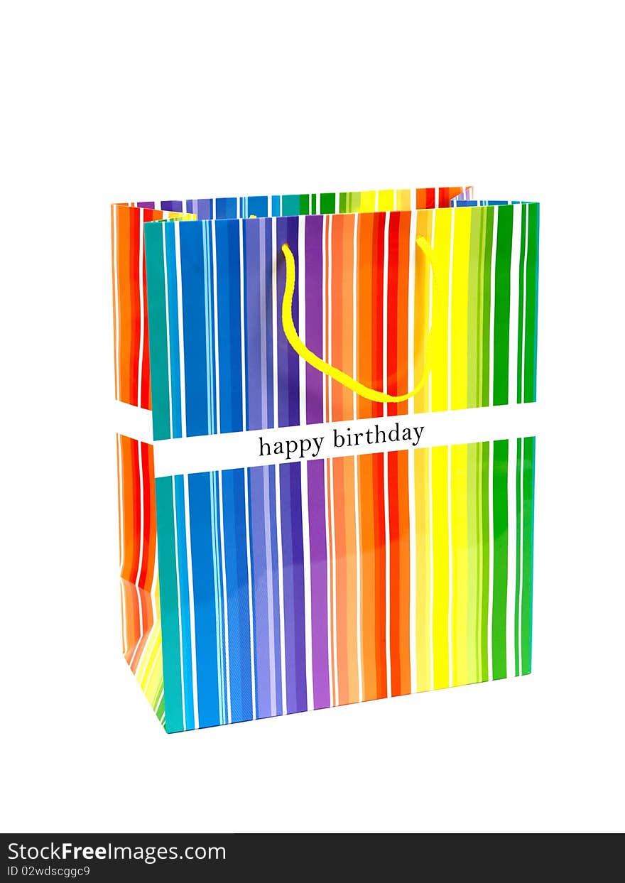 A happy birthday gift bag isolated against a white background