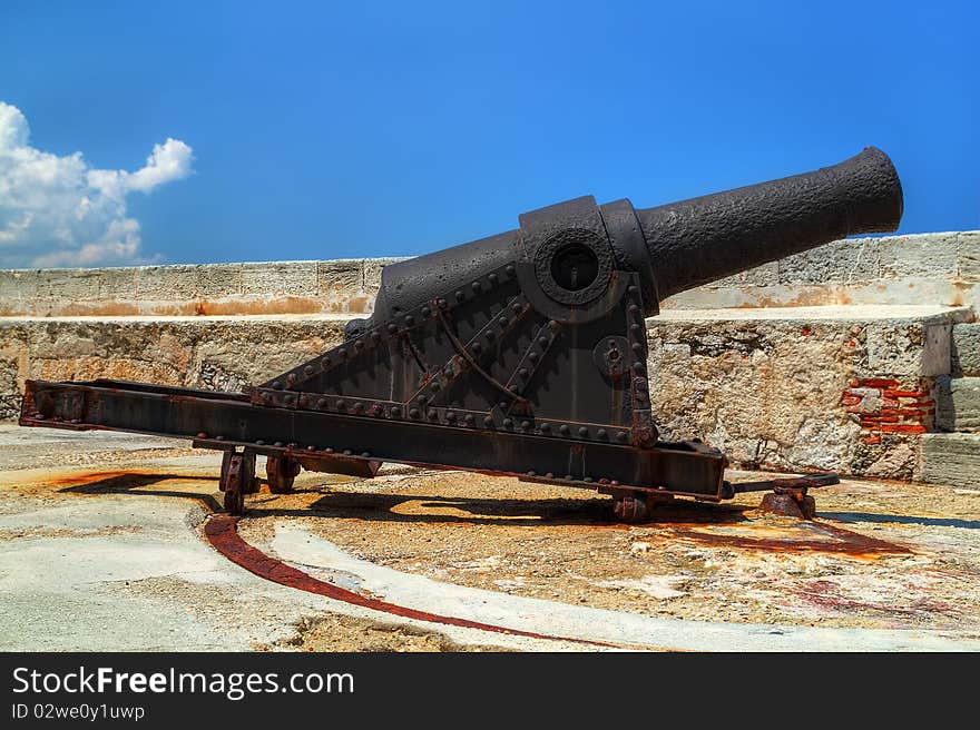 Old rusty cannon on a castle