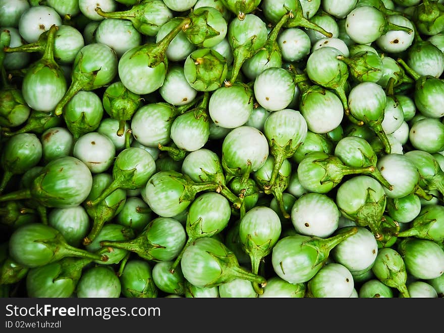 Many of green eggplant in fresh market background picture