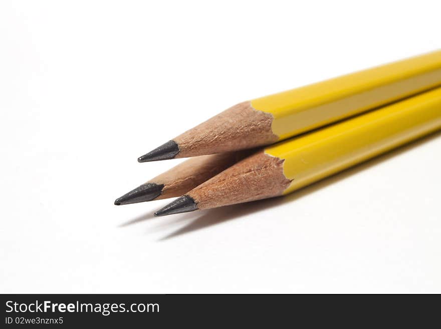 Close-up of three sharpened pencils