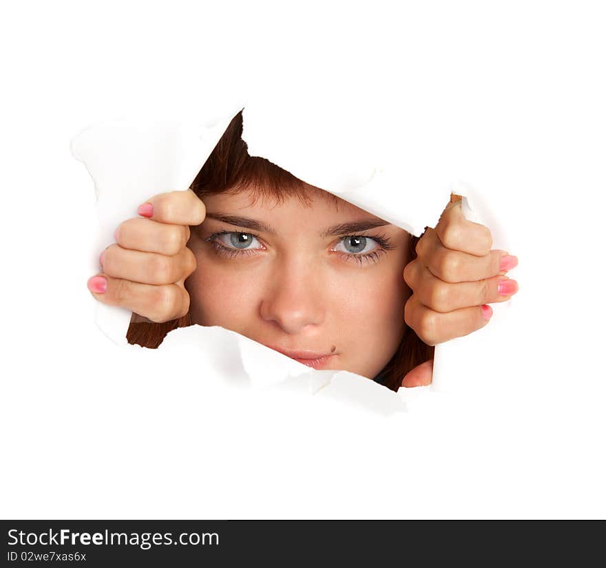 Girl is looking through a hole. Isolated on white background