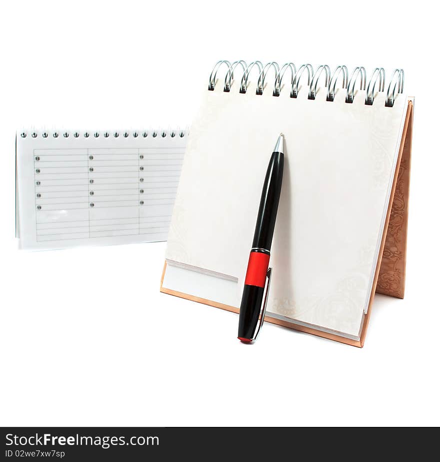 Diary with a pen on a white background