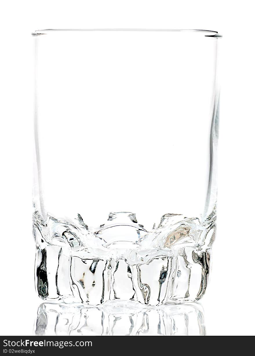 Empty glass on a white background with reflections on the floor