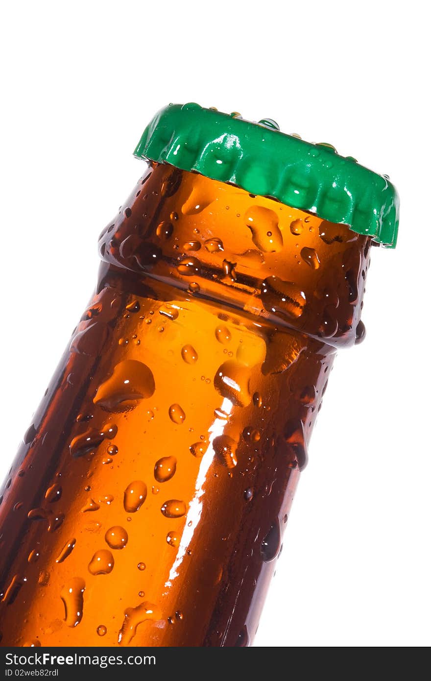 Bottle of beer with water drops on white background