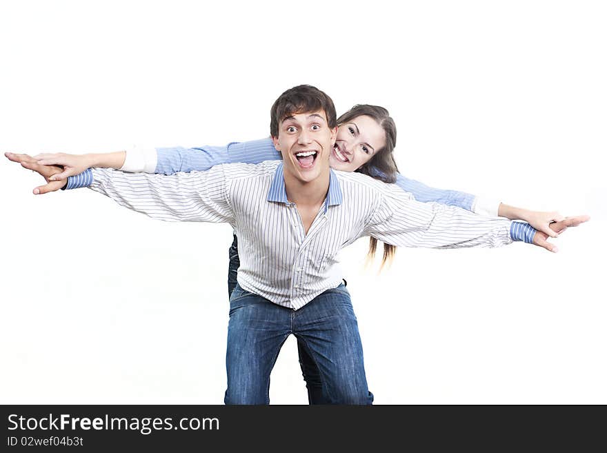 Two young happy person with the hands lifted upwards. Two young happy person with the hands lifted upwards