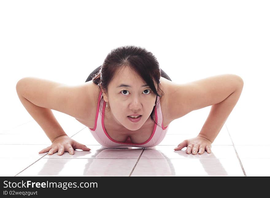 An Asian woman doing push-ups