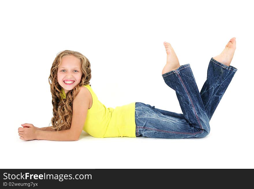 Beautiful 11 years old girl lying on the floor and smiling. Beautiful 11 years old girl lying on the floor and smiling