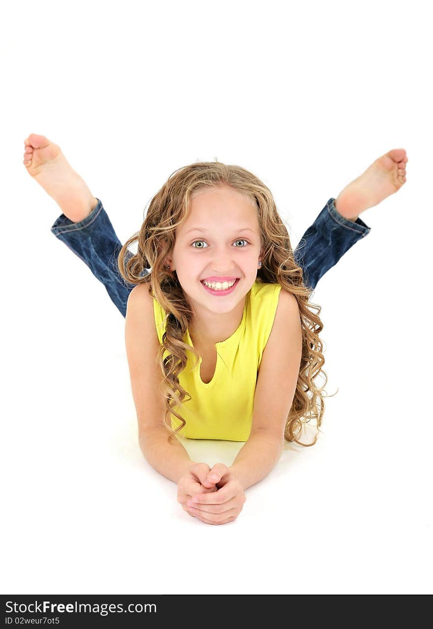 Beautiful 11 years old girl lying on the floor and laughing. Beautiful 11 years old girl lying on the floor and laughing