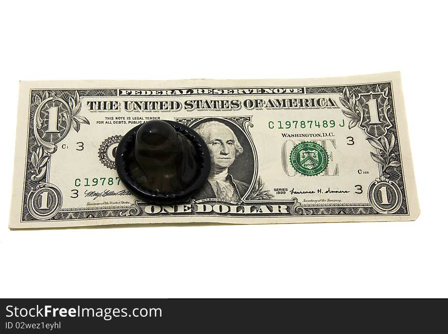 The open black condom lying on the American money. The open black condom lying on the American money