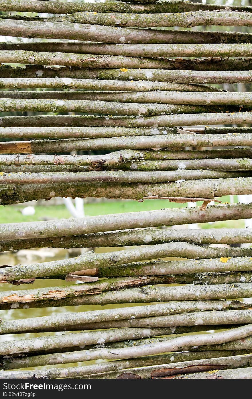 Part of the fence made of various branches