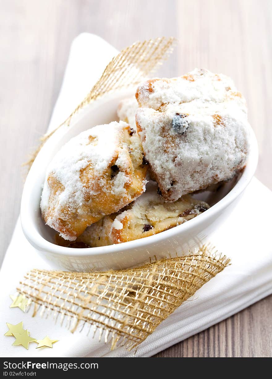 Fresh stollen cookies in a decorated bowl