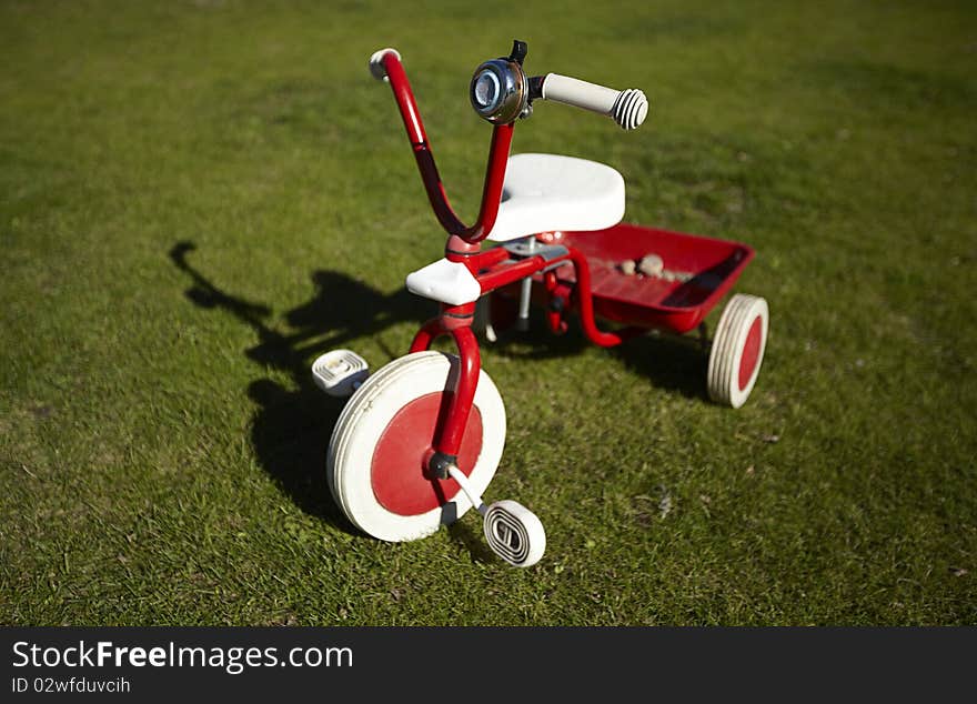 Redbike on  a green field