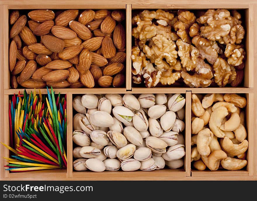 Nuts of different grades in a wooden box.