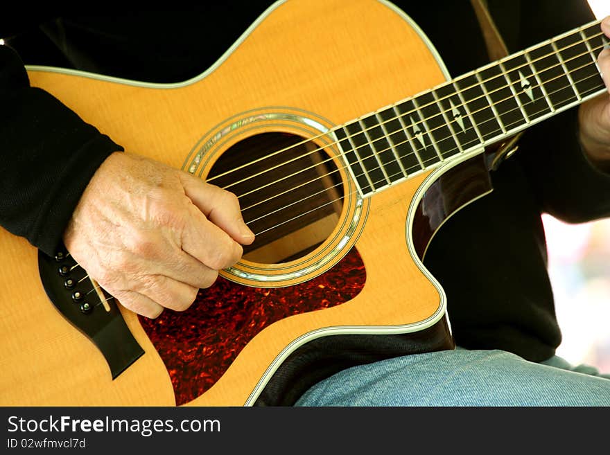 Man strumming guitar