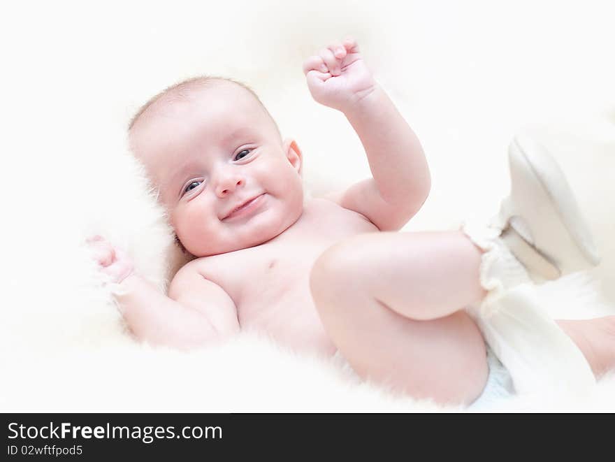 The small cheerful kid on a white background. The small cheerful kid on a white background