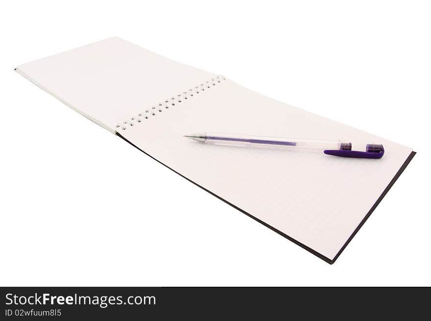 The image of notebook with the pen under the white background