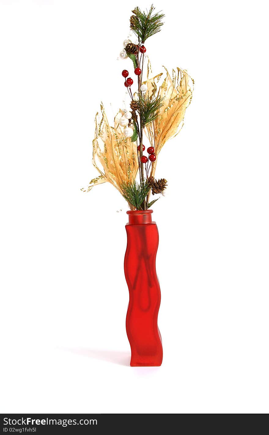 Christmas decoration in colored glass vase on white background