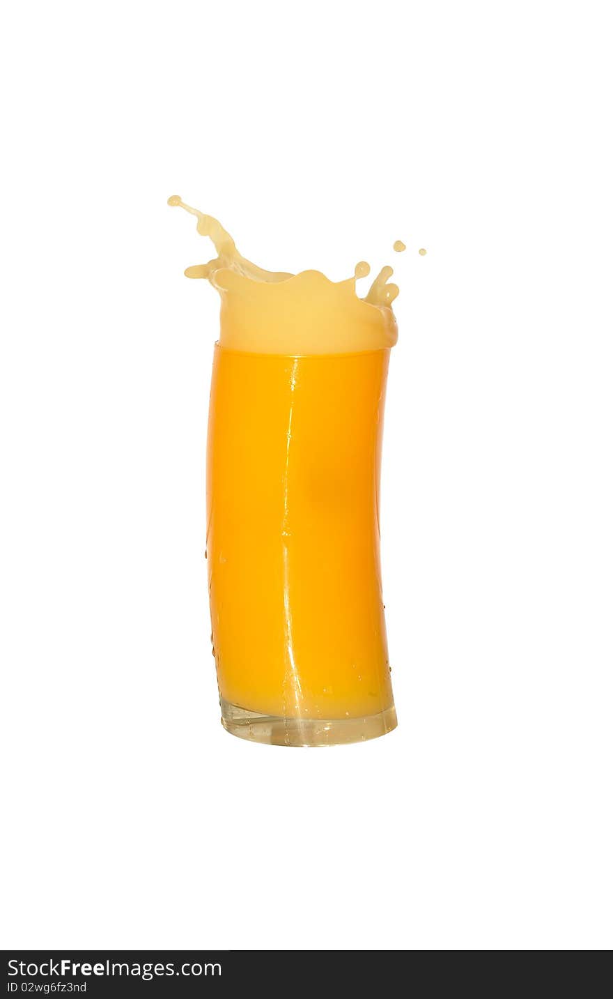 Nice yellow glass of splashing orange juice isolated on white background with clipping path