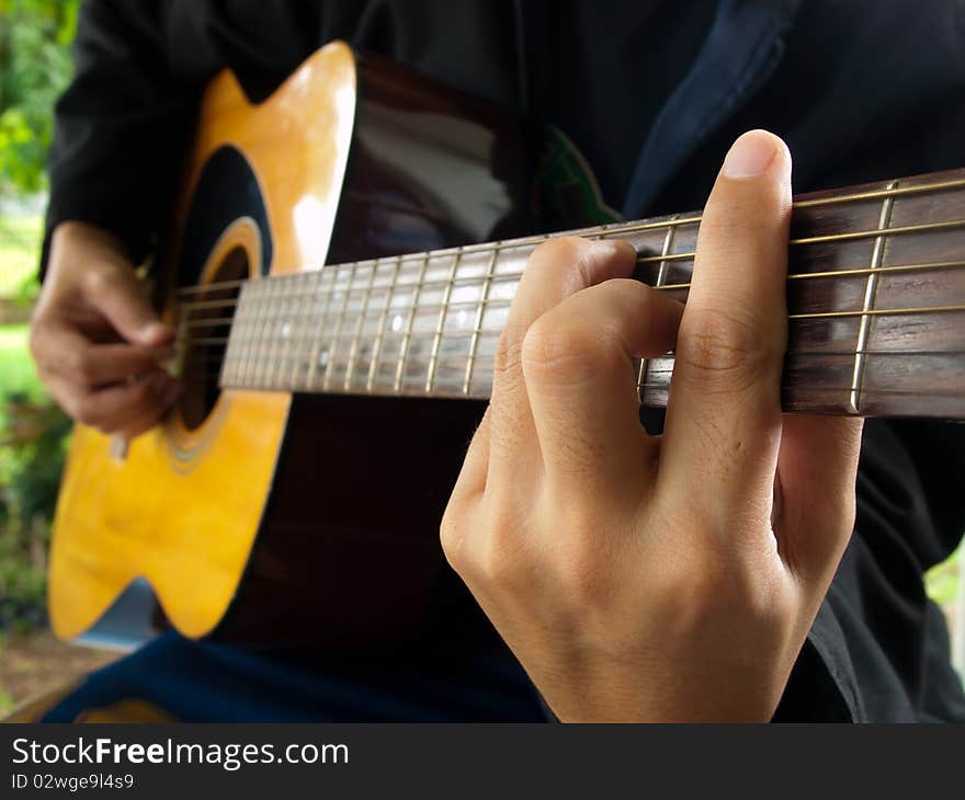 Man playing folk guitar ,in the mood