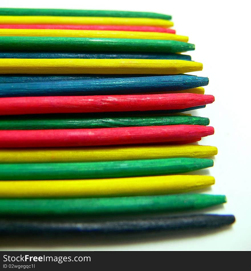 The points of different colored pick up sticks. The points of different colored pick up sticks.