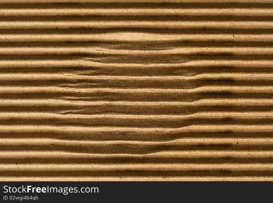 Brown corrugated cardboard texture, striped horizontally paper