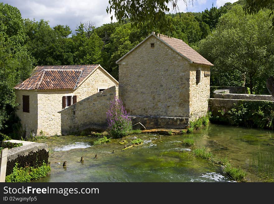 The house is surrounded by water