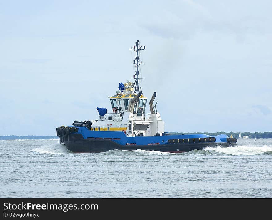 Blue and yellow tugboat 3