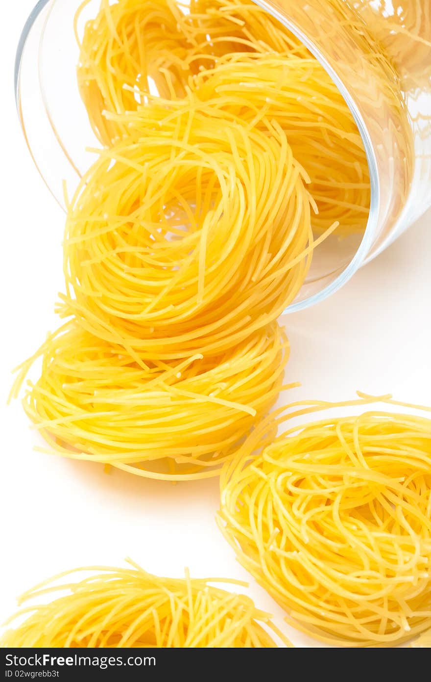 Pasta in glass jar on a white background