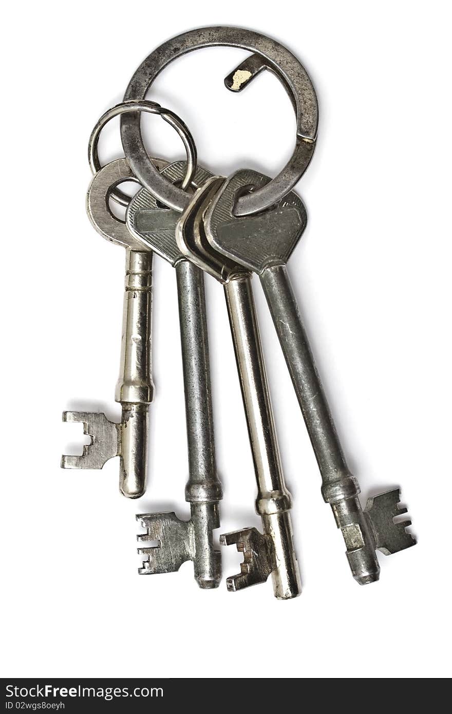 A bunch of old keys isolated on white background. A bunch of old keys isolated on white background